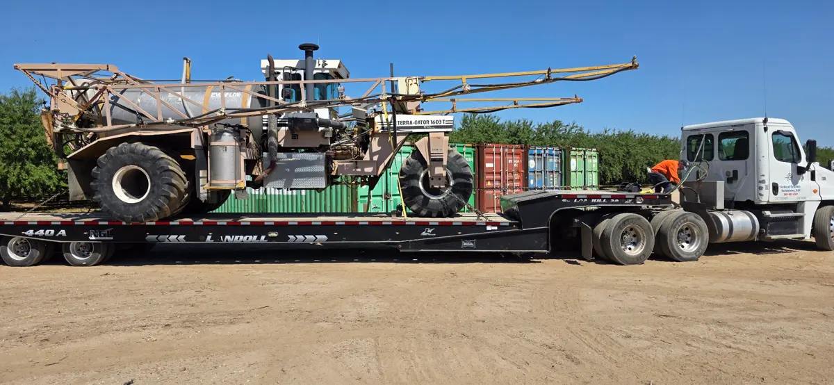 Terra-Gator 1603T heavy equipment transport on Landoll trailer Kern County